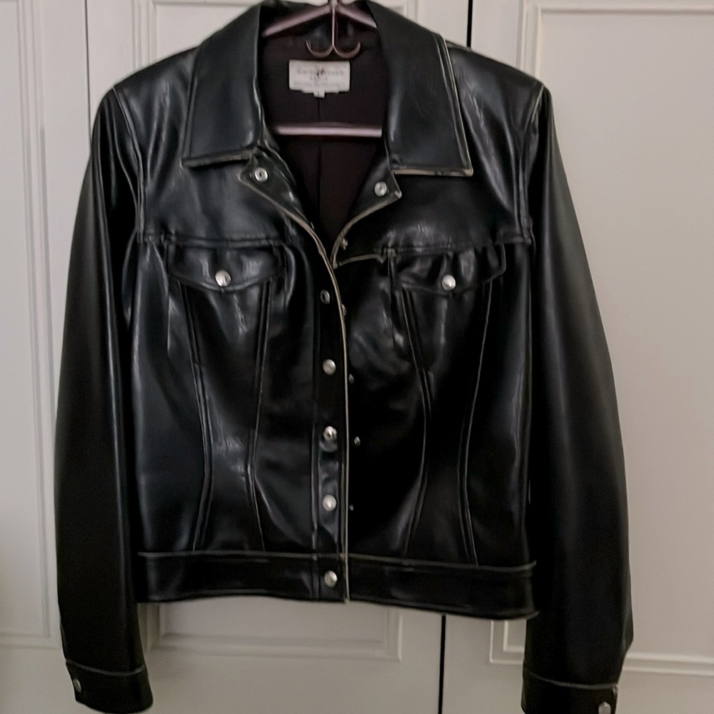 Faux Leather distressed edges, fitted, polyester lining.